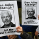 Demonstrators hold placards calling for WikiLeaks founder Julian Assange outside Westminster Magistrates Court in London on October 21, 2019